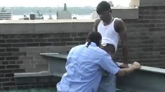 Sexy black gay partners engage in hardcore action on the roof top