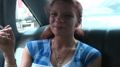 Ravishing redhead with big round boobs gives a nice blowjob in the car