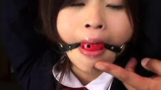 Rope bound Japanese schoolgirl toyed